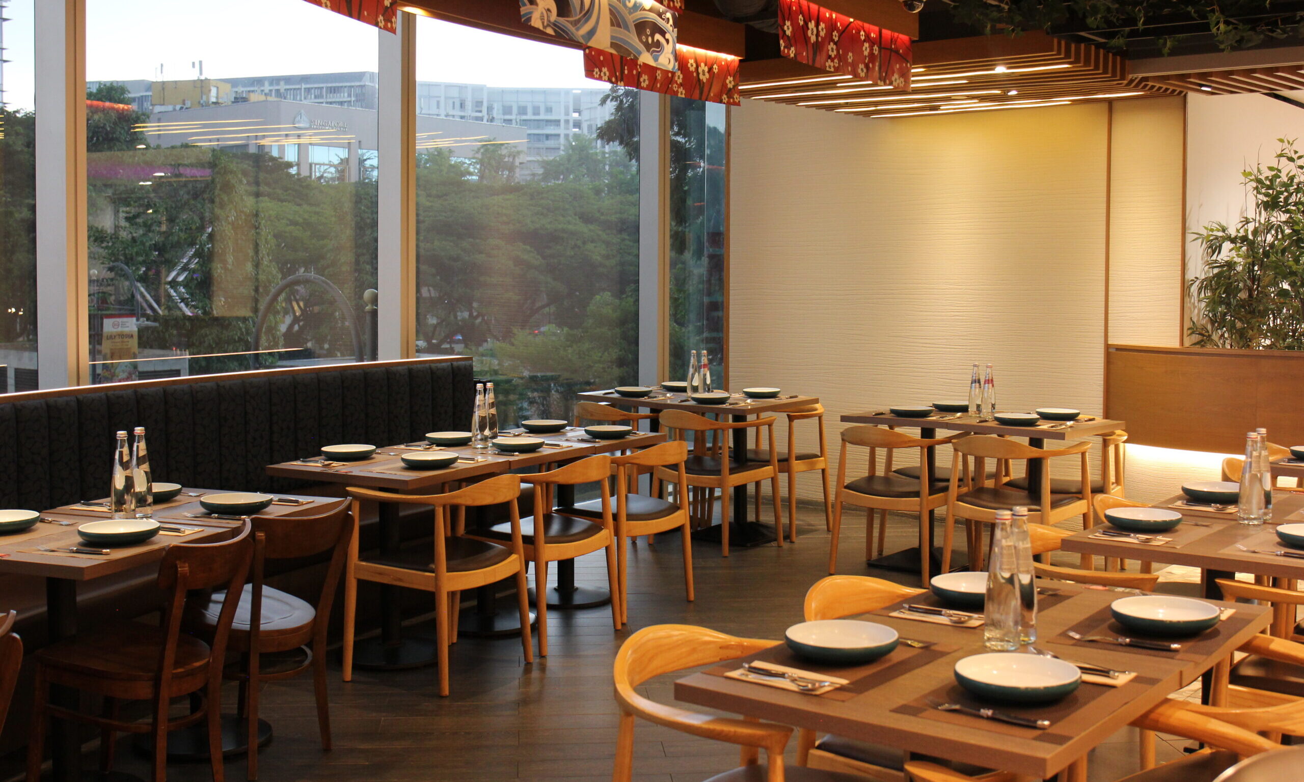 Dining space of up to 40 guests with extensive window panel showing Singapore's City view at BIZEN located in Plaza Singapura.